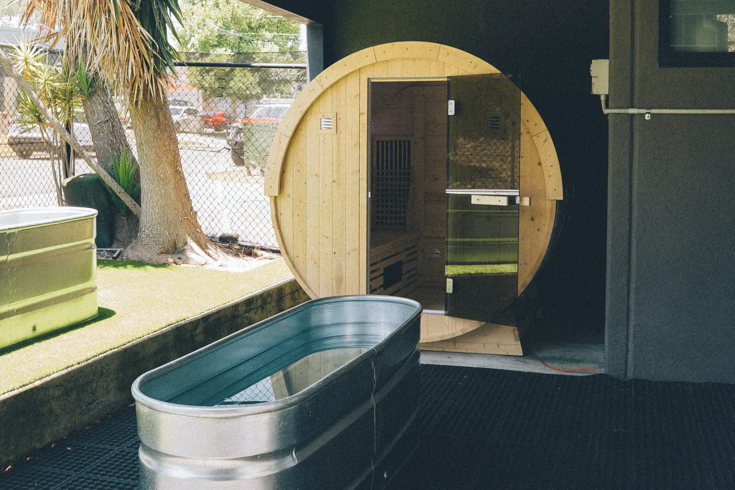 The infrared sauna and cold plunges on the lawn